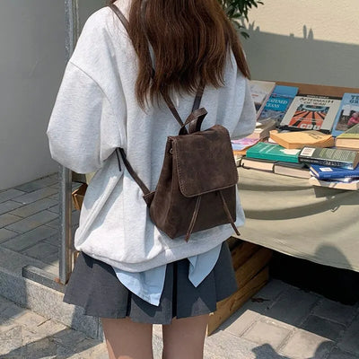 Abbey Drawstring Flap Backpack