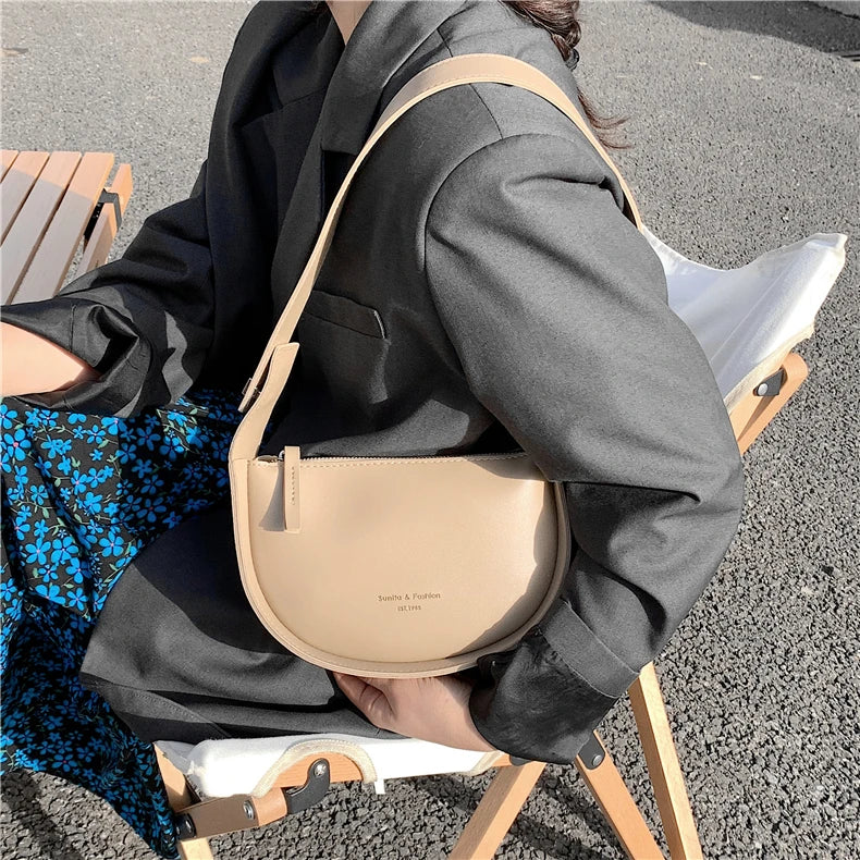 Mira Arc Saddle Crossbody Bag